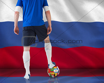 Football player standing with ball