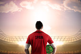 Spain football player holding ball