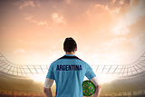 Argentina football player holding ball