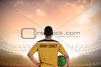Ivory coast football player holding ball