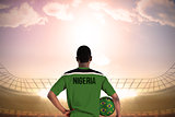 Nigeria football player holding ball