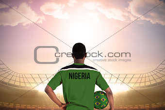 Nigeria football player holding ball