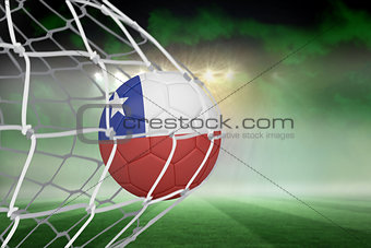 Football in chile colours at back of net