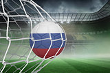 Football in russia colours at back of net