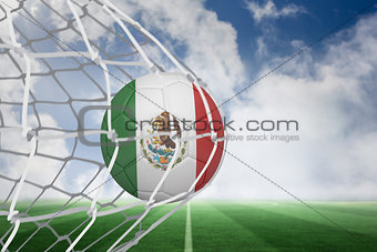 Football in mexico colours at back of net