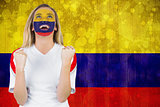 Excited colombia fan in face paint cheering