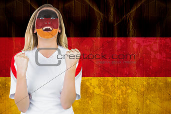 Excited german fan in face paint cheering