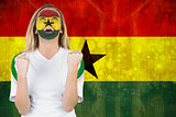 Excited ghana fan in face paint cheering