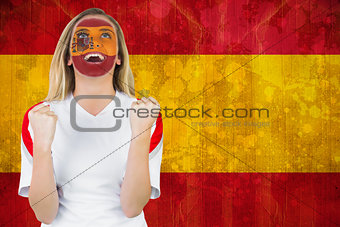 Excited spain fan in face paint cheering