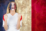 Excited france fan in face paint cheering