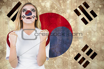 Excited south korea fan in face paint cheering