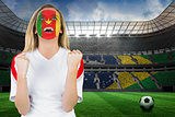 Excited cameroon fan in face paint cheering
