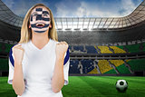 Excited greece fan in face paint cheering