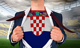 Businessman opening shirt to reveal croatia flag