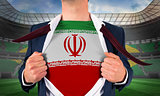 Businessman opening shirt to reveal iran flag