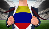Businessman opening shirt to reveal colombia flag