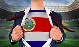 Businessman opening shirt to reveal costa rica flag