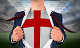 Businessman opening shirt to reveal england flag