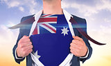 Businessman opening shirt to reveal australia flag