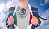 Businessman opening shirt to reveal mexico flag