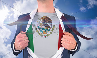Businessman opening shirt to reveal mexico flag