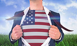 Businessman opening shirt to reveal usa flag