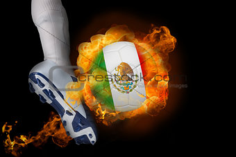 Football player kicking flaming mexico ball