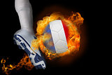 Football player kicking flaming france ball