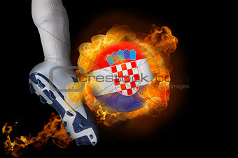 Football player kicking flaming croatia ball