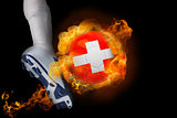 Football player kicking flaming switzerland ball