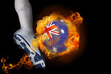 Football player kicking flaming australia ball