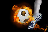 Football player kicking flaming ball