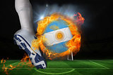 Football player kicking flaming argentina flag ball