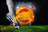 Football player kicking flaming spain flag ball