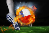 Football player kicking flaming chile flag ball