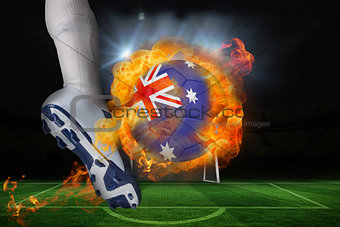 Football player kicking flaming australia flag ball