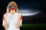 Excited ecuador fan in face paint cheering