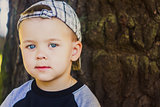 Happy child wearing striped cap in outdoor portrait