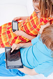 Two Children Having Fun with Digital Gadgets