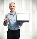 businessman showing blank laptop computer