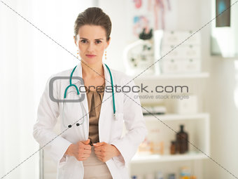 Portrait of medical doctor woman in office