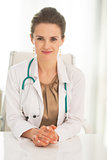 Portrait of medical doctor woman sitting in office