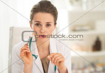 Portrait of medical doctor woman explaining something