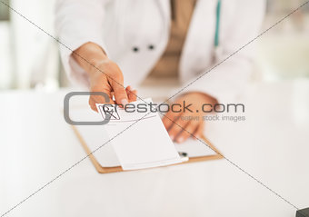 Closeup on medical doctor woman giving prescription