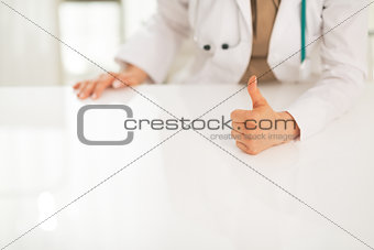 Closeup on medical doctor woman showing thumbs up