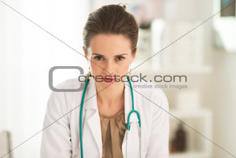 Portrait of serious medical doctor woman