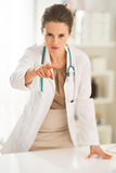 Closeup on medical doctor woman pointing in camera