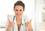 Medical doctor woman showing thumbs up