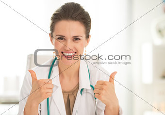 Medical doctor woman showing thumbs up