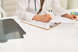 Closeup on medical doctor woman working in office